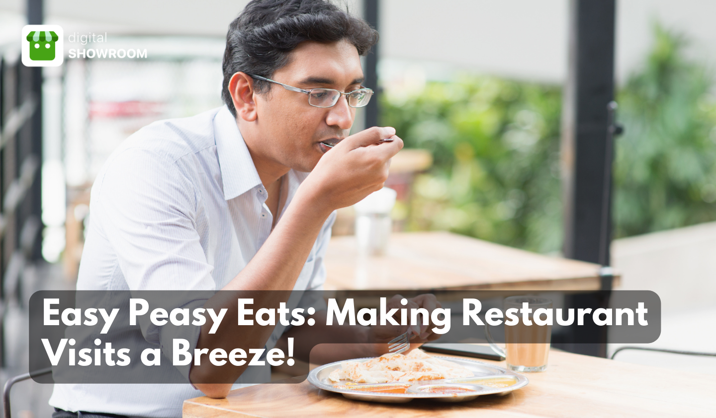 Indian man eating at a restaurant.